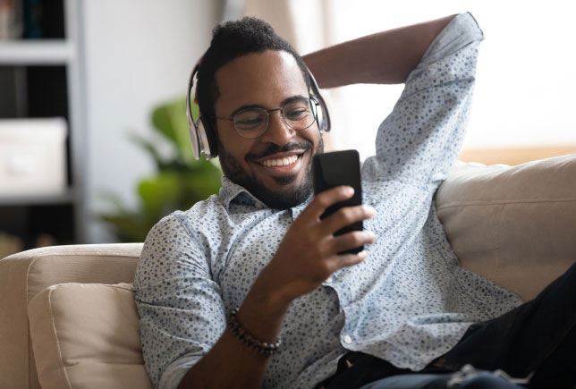 sitting with phone on couch